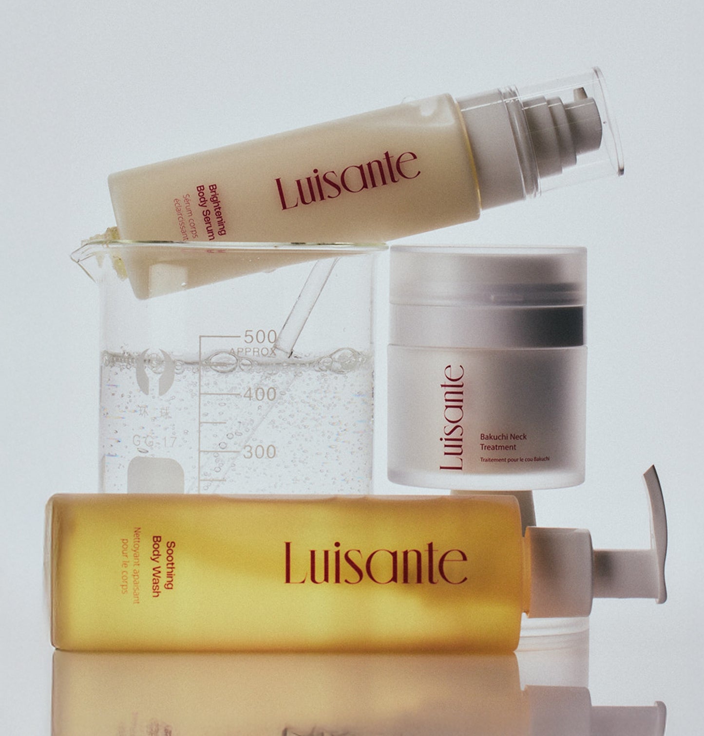 Luisante Skincare Set featuring hydrating body wash, treatment cream, and cleanser for glowing skin